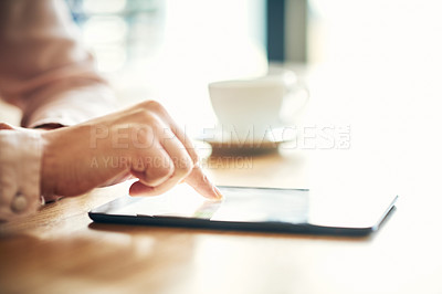 Buy stock photo Cropped shot of an unrecognizable businesswoman using a digital tablet in an office