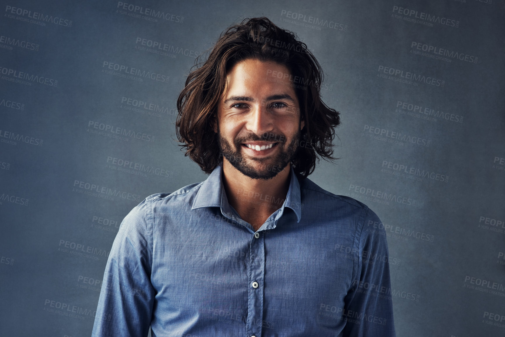 Buy stock photo Business man, long hair and smile in studio portrait with confidence, pride and formal shirt by background. Person, model and happy for clothes, fashion and trendy style for career in Barcelona