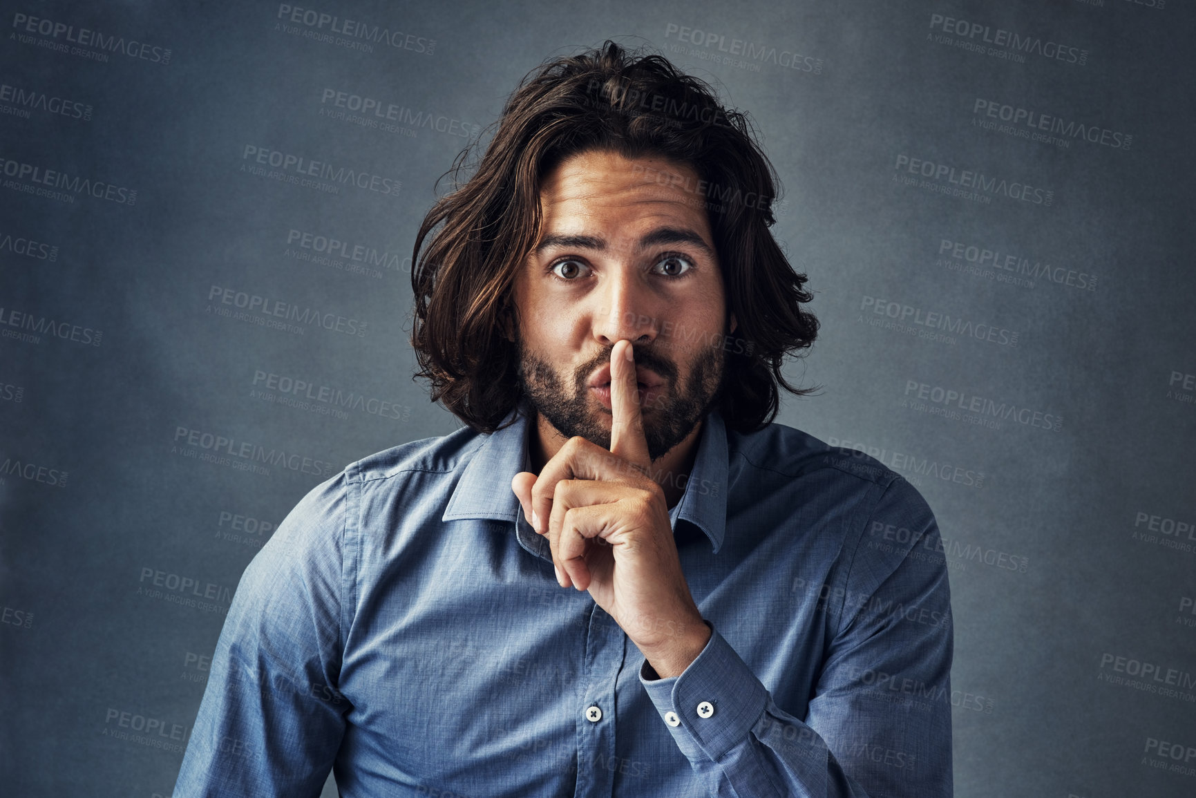 Buy stock photo Businessman, portrait and finger on lips in studio for secret, sensitive information and professional privacy. Male employee, hand gesture and quiet on gray background for mystery communication.