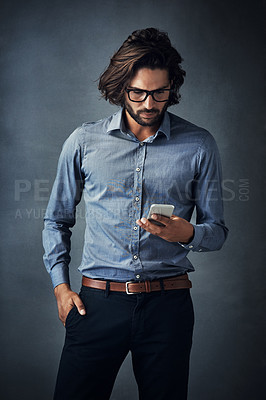 Buy stock photo Studio, business man and serious with mobile phone for chat, text message and online disagreement with contact. Salesperson, glasses and reading on cellphone app, client issue and gray background