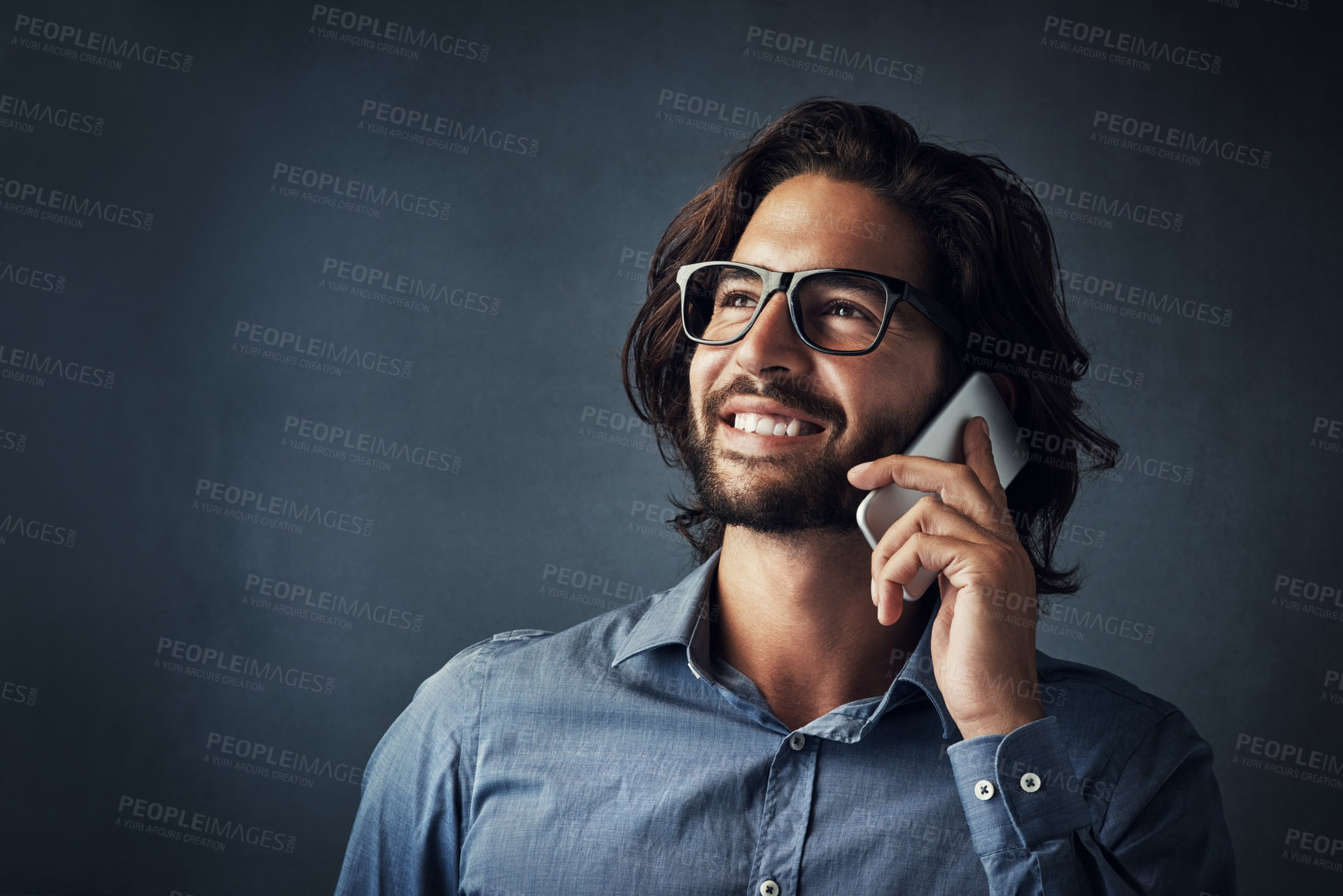 Buy stock photo Businessman, thinking and listening with phone call for decision or communication on a dark studio background. Young male person or employee talking in wonder on mobile smartphone for business chat