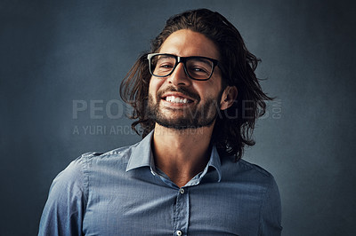 Buy stock photo Cropped shot of a handsome young man posing against a grey background