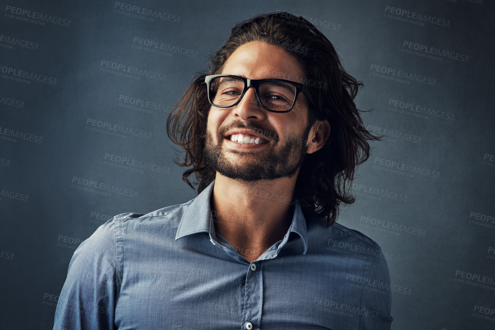 Buy stock photo Smile, glasses, and portrait of man in studio with confidence, casual fashion and creative business style. Face, pride and happy businessman with professional design consultant on blue background