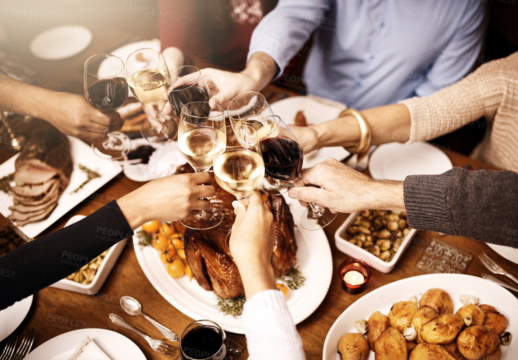 Buy stock photo Hands, turkey and cheers for festive, thanksgiving or meat for reunion of family, dinner or celebration. Chicken, glass and wine for toast, holiday or people in dining room, Christmas or food in home