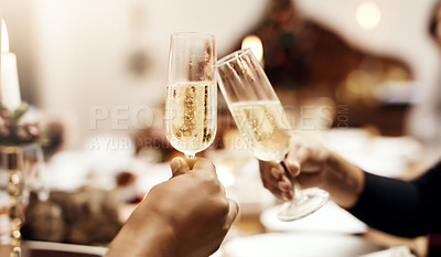 Buy stock photo Cropped shot of people making a toast over Christmas lunch
