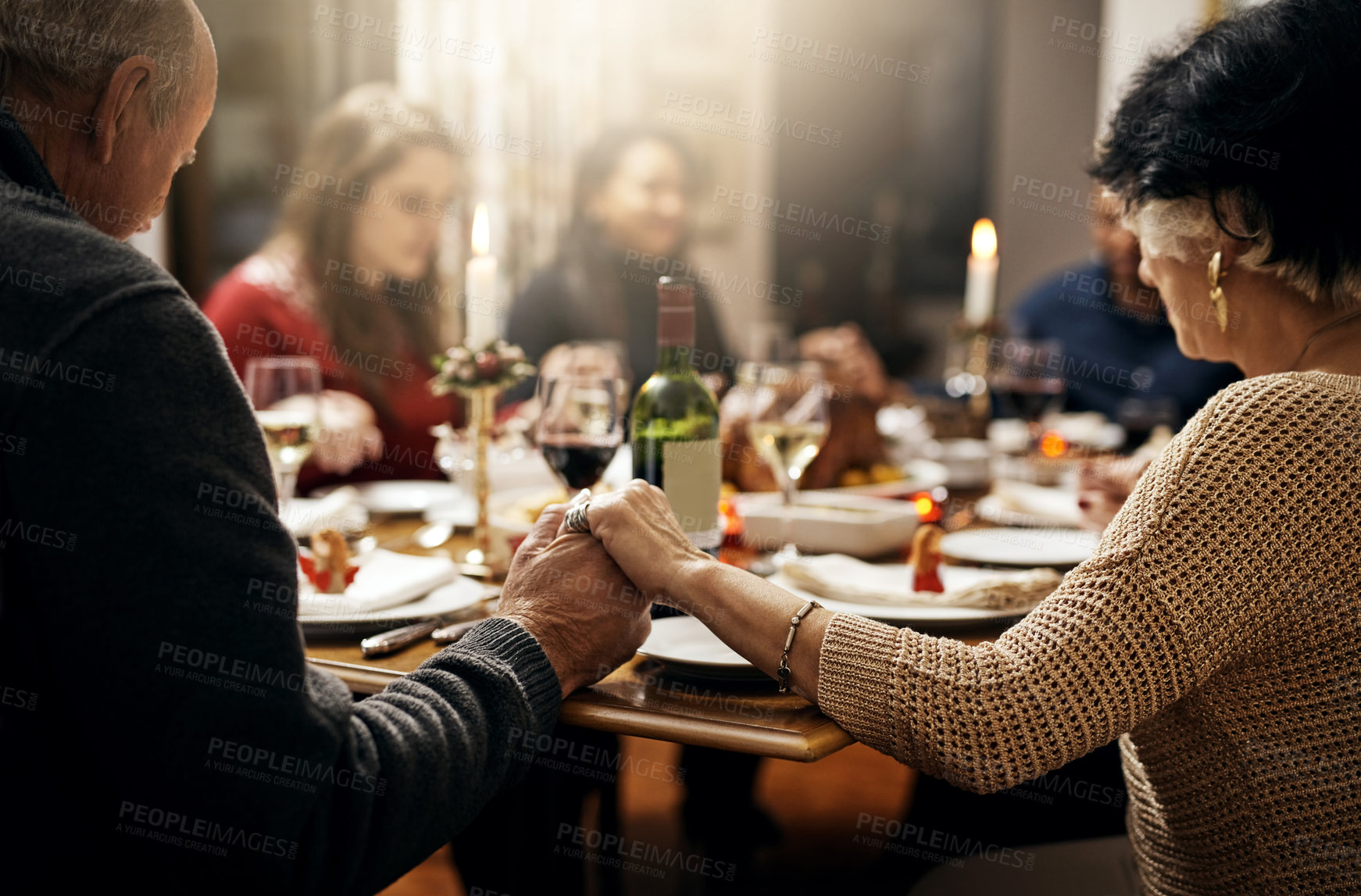 Buy stock photo Food, thanksgiving and hand holding with family at table in dining room for holiday, prayer or worship. Celebration, support and gratitude with people praying at home for kindness, dinner and love