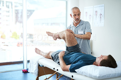 Buy stock photo Physical therapist, client and man with leg injury, healing and consultation for rehabilitation. Male person, customer and chiropractor with physiotherapist, healthcare and wellness with stretching 