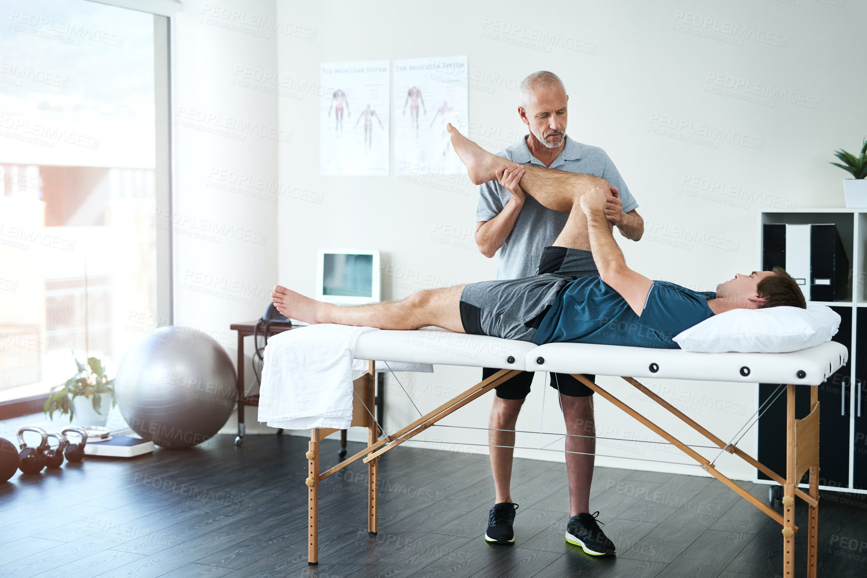 Buy stock photo Physical therapy, men and client with leg injury, service and healing with wellness, stress relief and expert with skill. Consultation, physiotherapist or patient with stretch, health and diagnosis