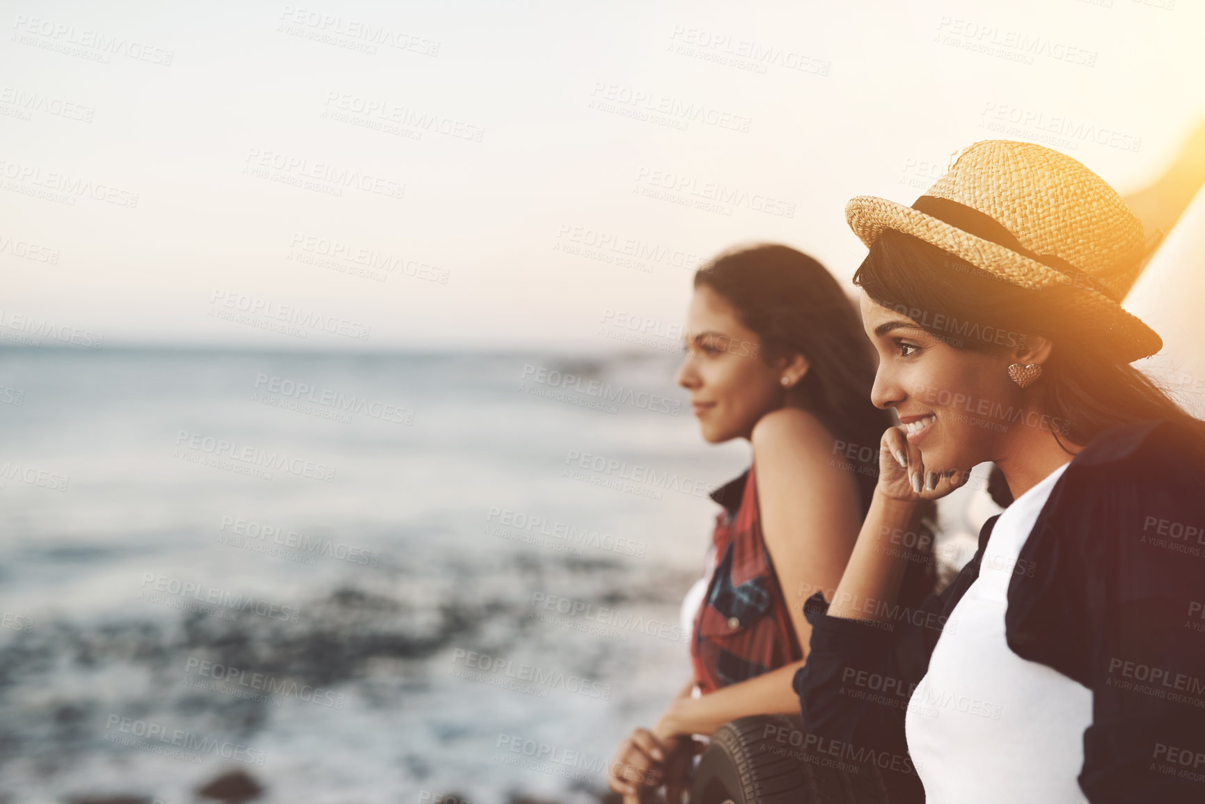 Buy stock photo Happy, friends and women at beach for holiday, summer vacation and bonding in nature on weekend. Lens flare, travel and people with ocean view smile for adventure, fun and relax together by seaside