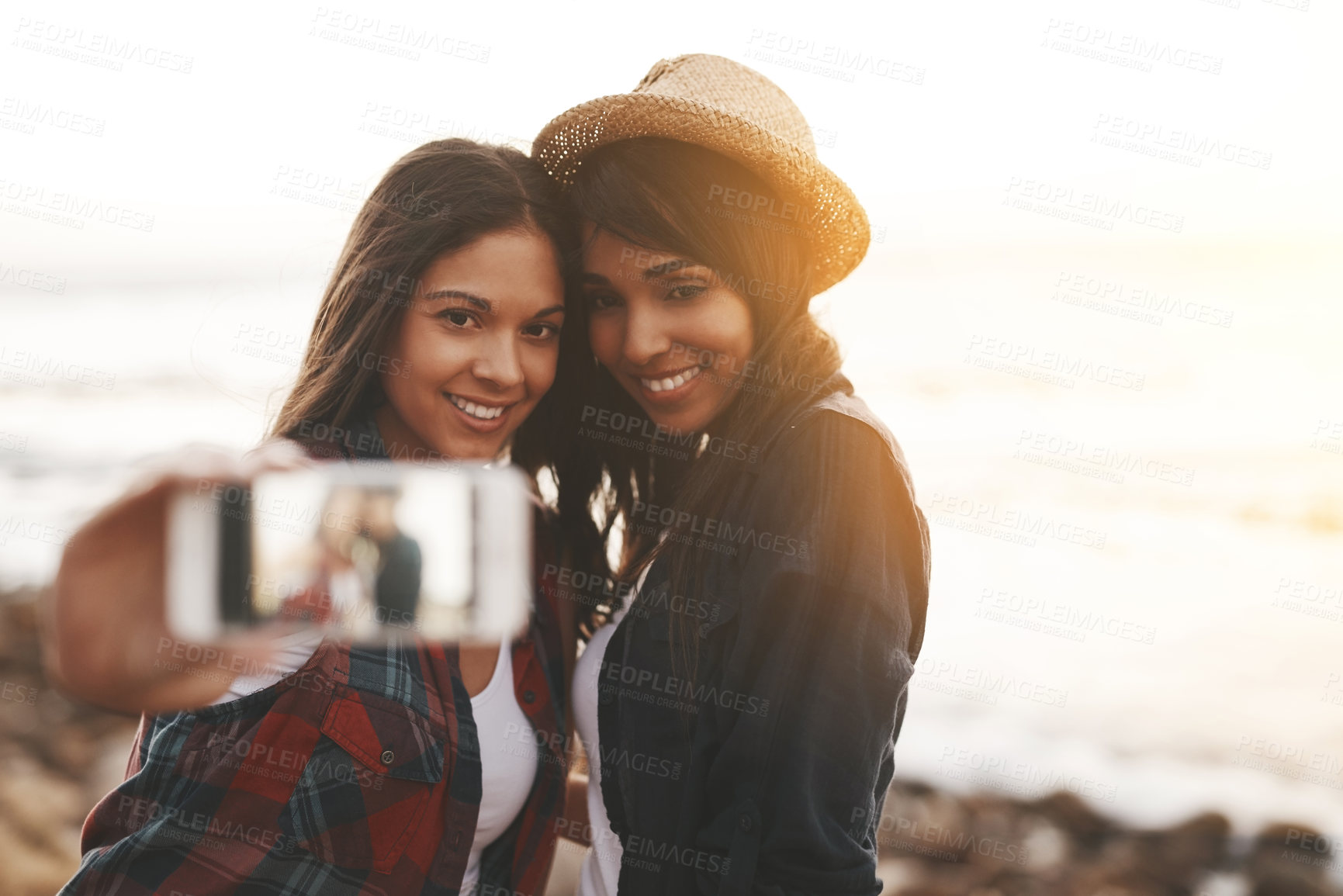 Buy stock photo Selfie, phone screen and women by beach to travel on summer holiday, vacation and bonding on weekend. Friends, happy and people on cellphone for photo on social media, online post and profile picture