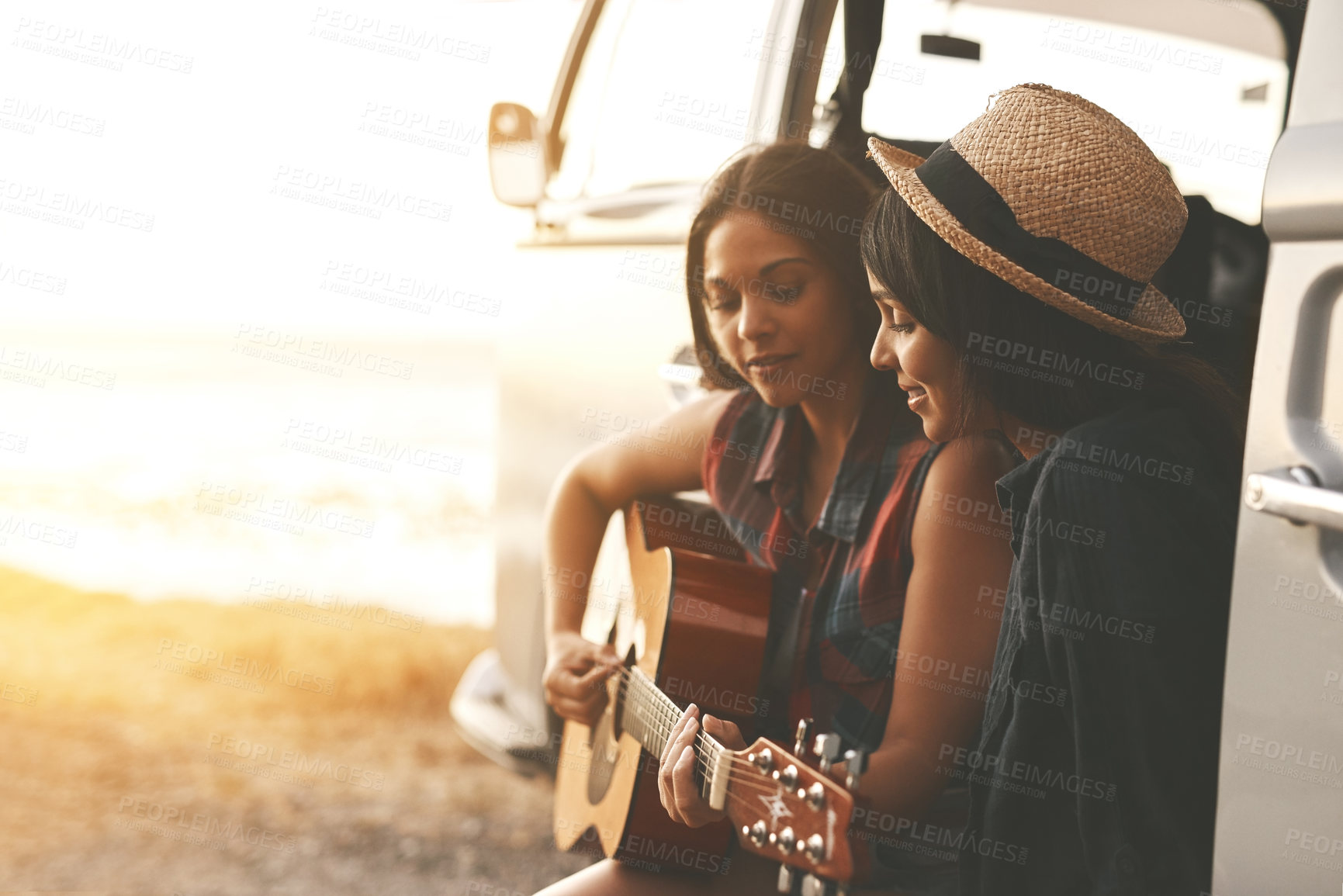 Buy stock photo Road trip, music and women in car with guitar, singing and travel in countryside. Friendship, girls or sunset on journey with instrument, bonding and talent with transportation for break on vacation