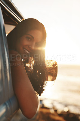 Buy stock photo Woman, portrait and smile by window for road trip, sunset and adventure at beach with water or view. Female person, ocean and van for travel, dusk and journey outdoor with happiness, relax and peace