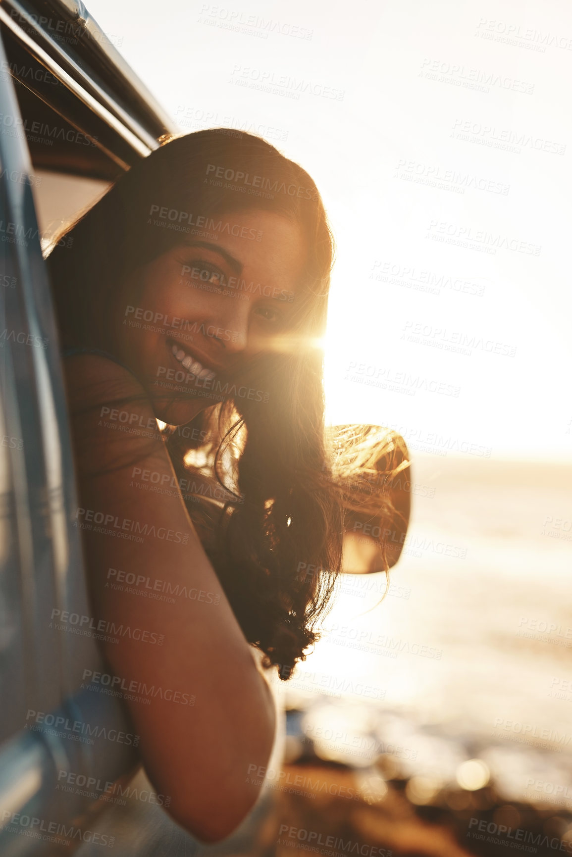 Buy stock photo Woman, portrait and smile by window for road trip, sunset and adventure at beach with water or view. Female person, ocean and van for travel, dusk and journey outdoor with happiness, relax and peace