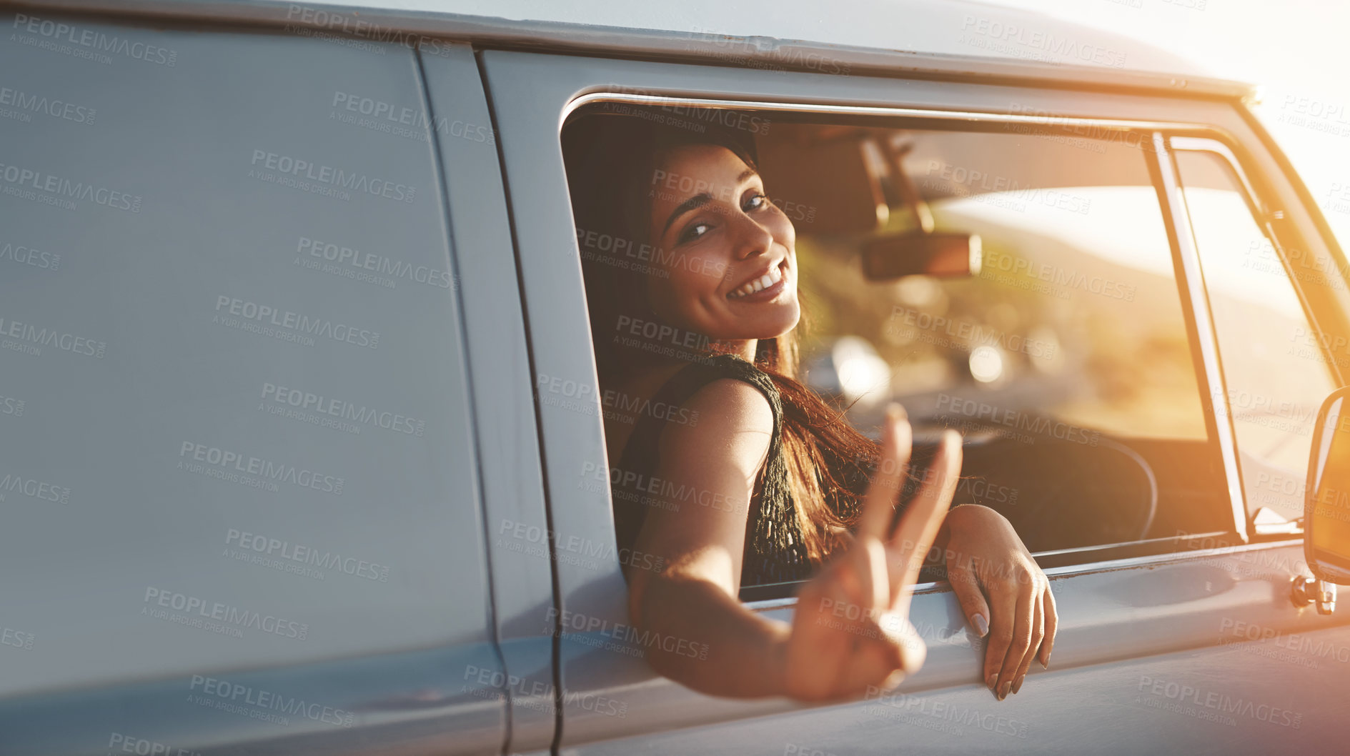 Buy stock photo Woman, happy and peace in van for road trip, sunset and adventure in summer with sign or flare. Female person, portrait and car for travel, dusk and journey outdoor with sunshine, freedom and drive