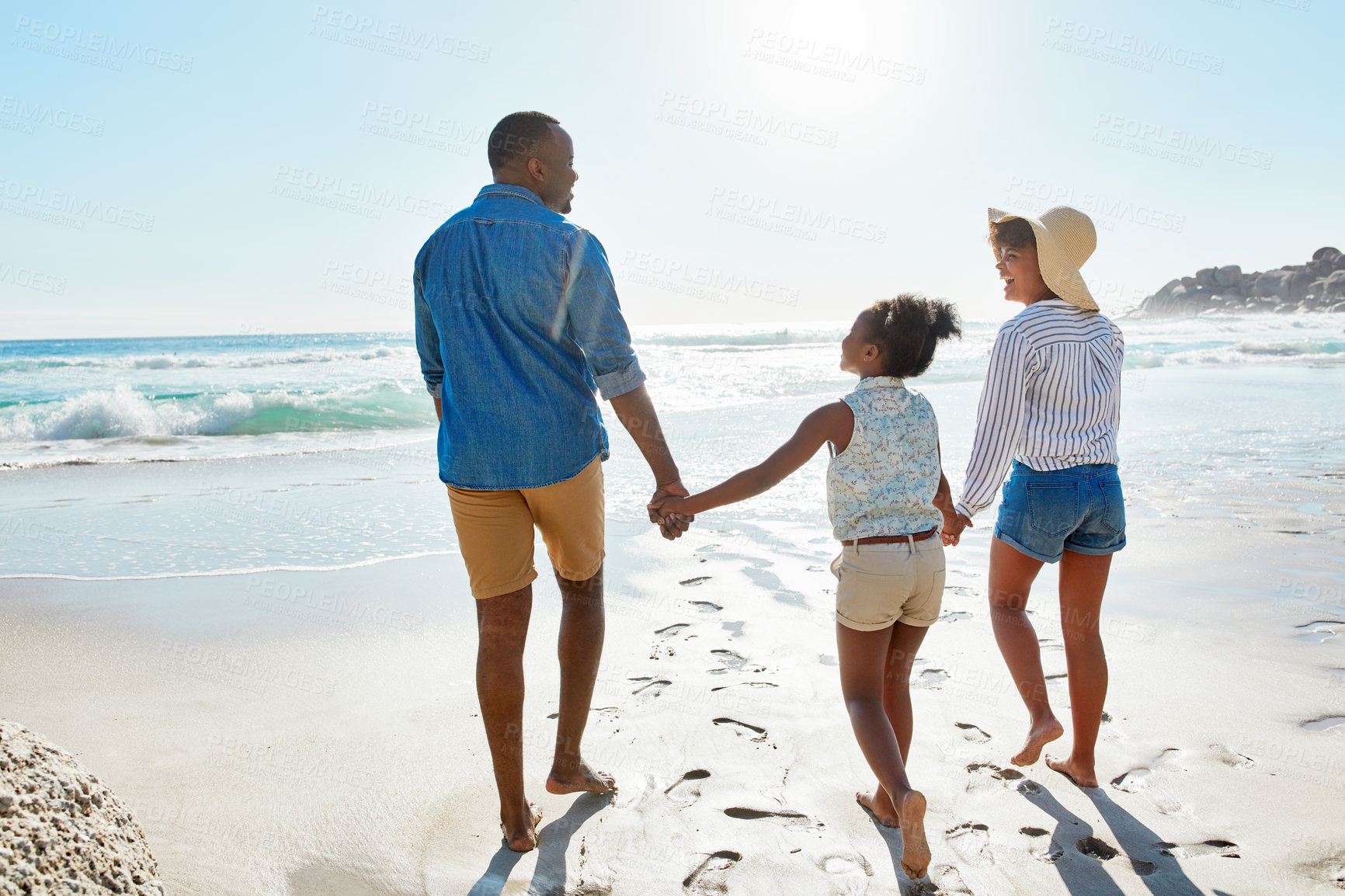 Buy stock photo Happy family, tropical and beach walk during summer on vacation relaxing and enjoying the scenery at the ocean. Sea, water and parents with daughter, child or kid with childhood freedom