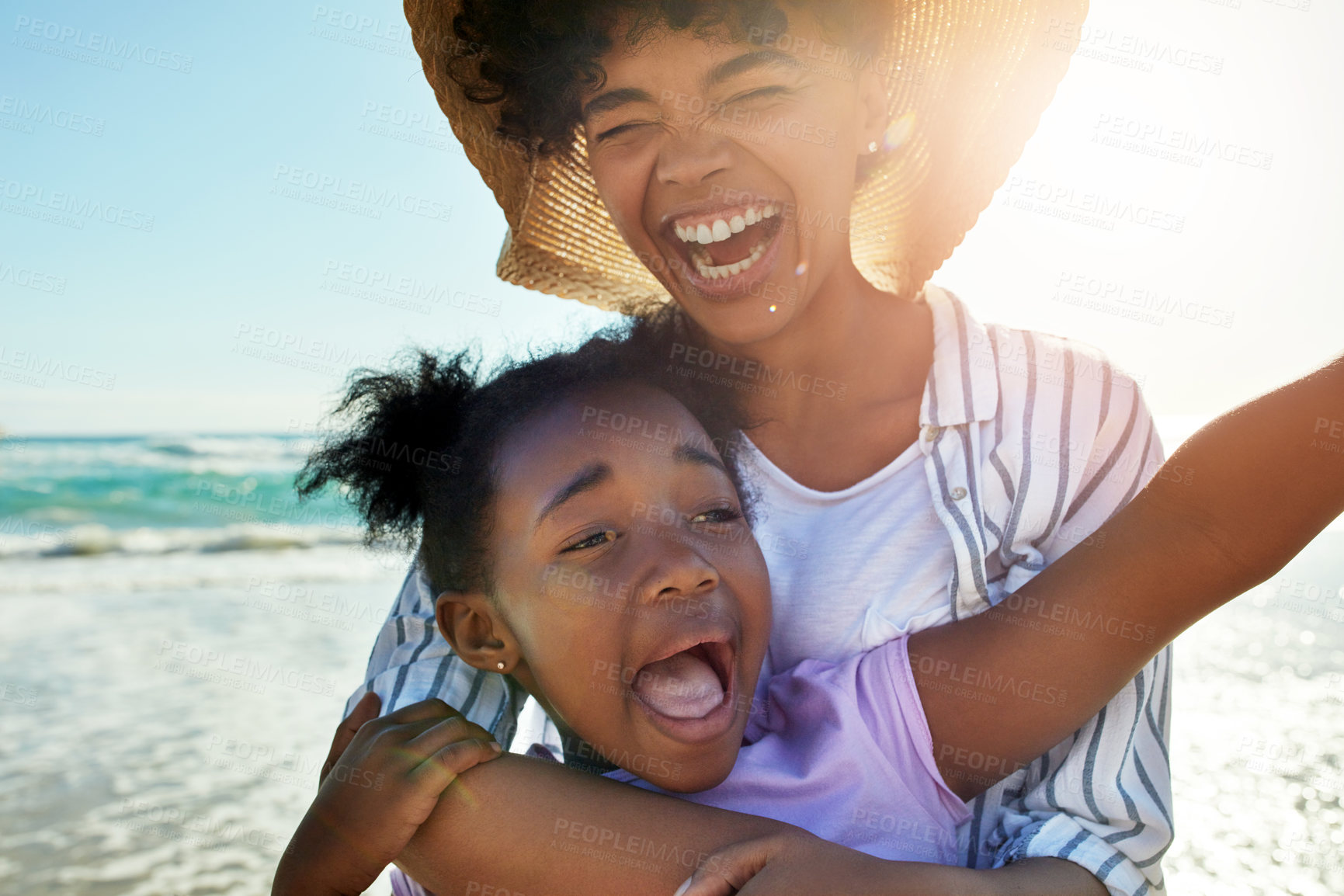 Buy stock photo Family, children and beach with a mother and daughter laughing or joking together in the ocean or sea. Love, kids and coast with a black woman and girl having fun while bonding by the water in nature