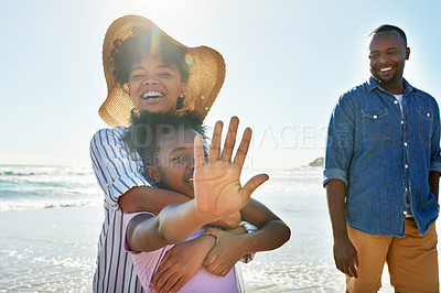 Buy stock photo Relax, smile and fun with black family at beach for happy summer break, bonding at tropical vacation. Travel and happiness with parents and daughter playing by the ocean for freedom, sea and care