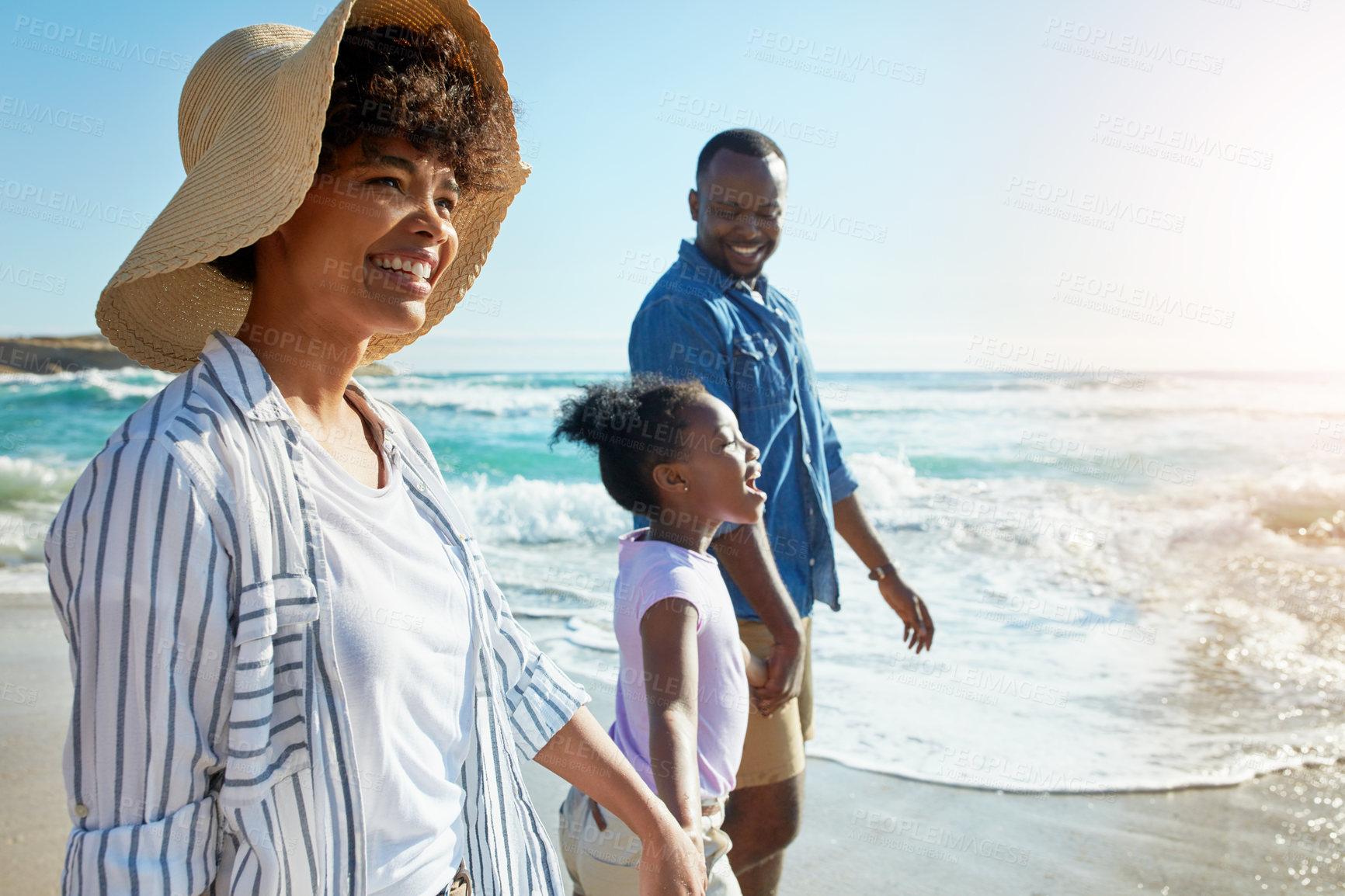 Buy stock photo Happy family, summer and beach walk by parents and child on vacation or holiday at the ocean or sea. Travel, mother and father with African daughter or kid holding hands together near water