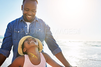 Buy stock photo Shot of an adorable little girl having fun with her father  on the beach