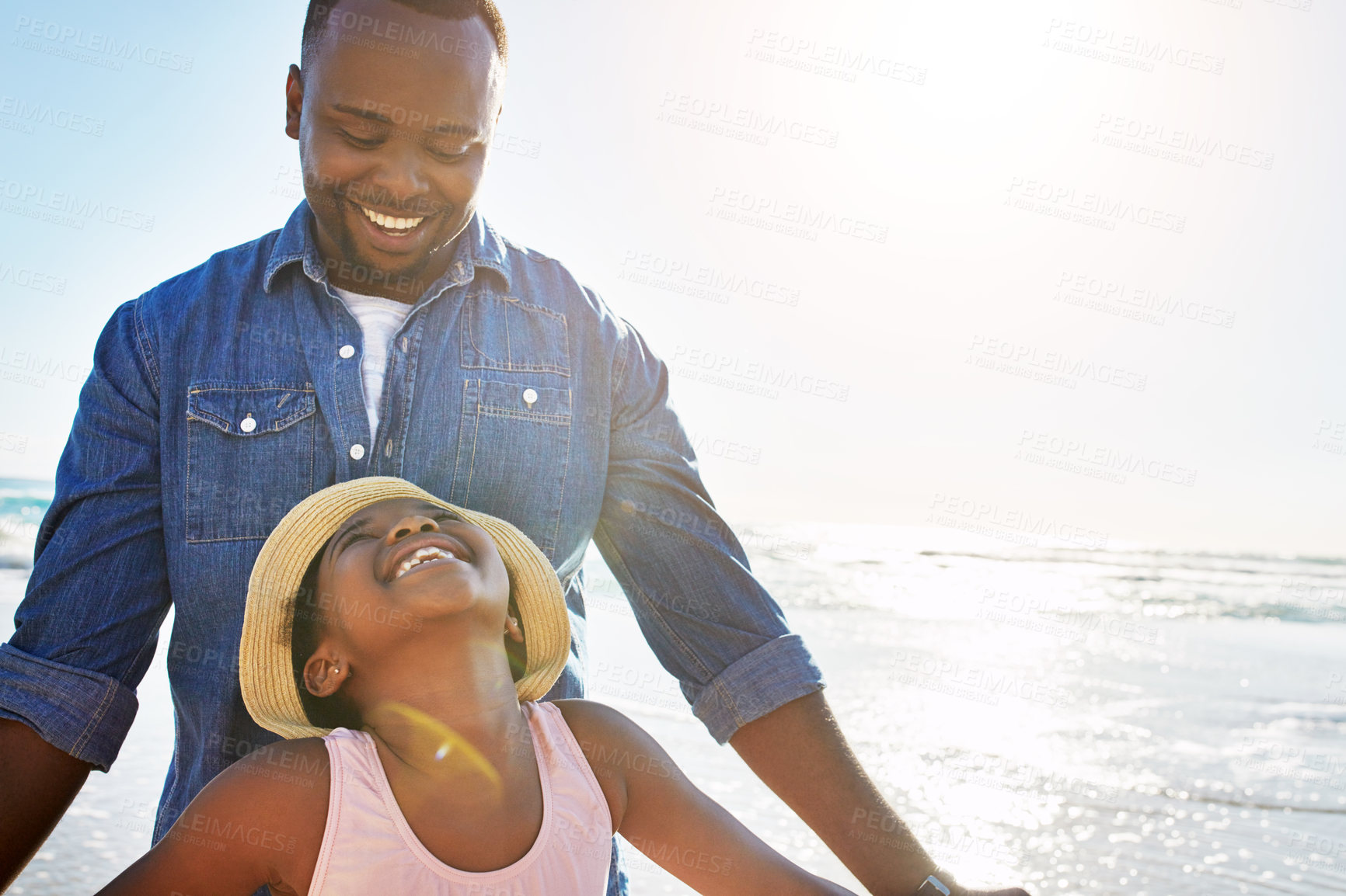 Buy stock photo Shot of an adorable little girl having fun with her father  on the beach