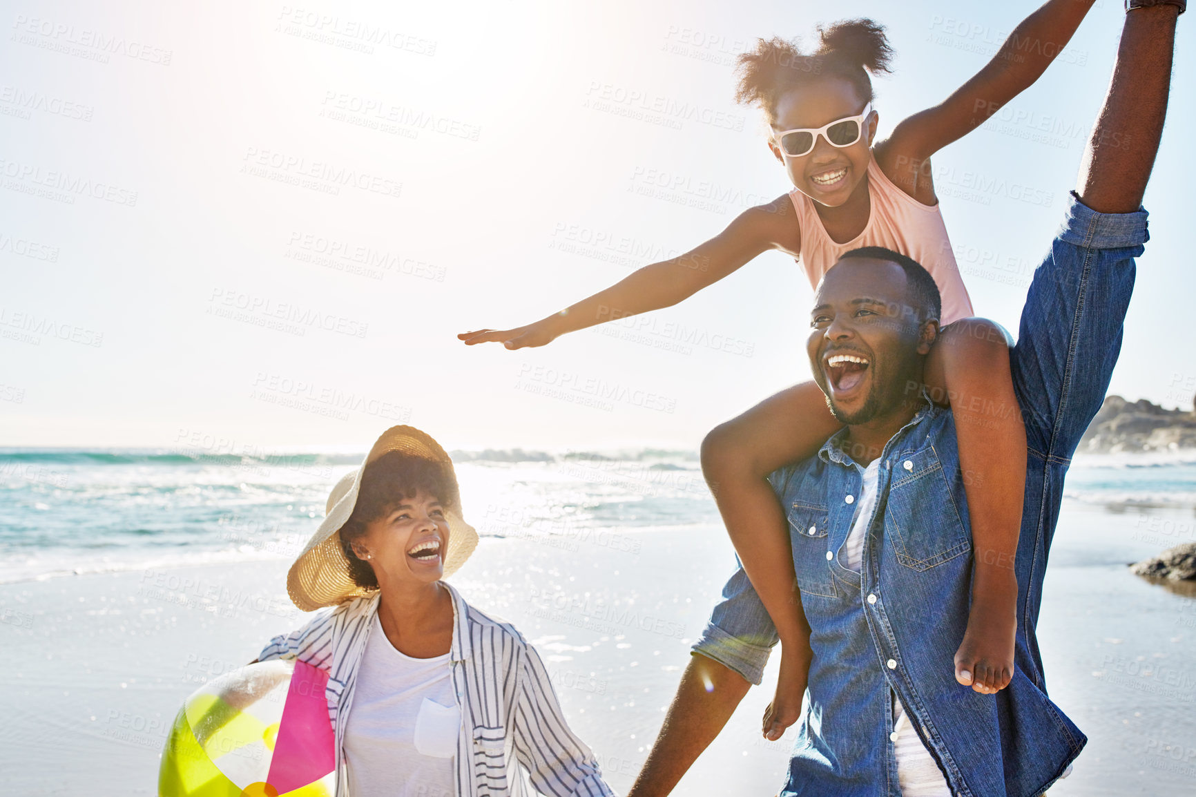 Buy stock photo Family, beach and girl on shoulder of father enjoying holiday, vacation and freedom on weekend. Summer, travel and happy dad, mom and child smile on adventure for bonding, relaxing and fun by ocean