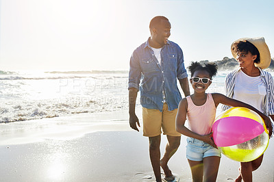 Buy stock photo Black family, mockup or beach with a mother, father and daughter carrying a ball while walking on the sand by the sea. Love, children and ocean with a man, woman and girl child on the coast in summer