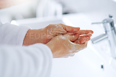 Buy stock photo Cropped shot of an unrecognizable woman washing her hands