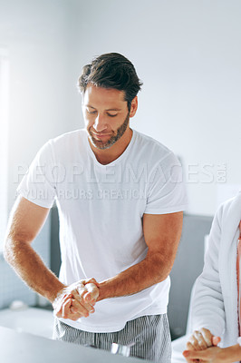 Buy stock photo Cropped shot of a couple washing their hands in the basin at home