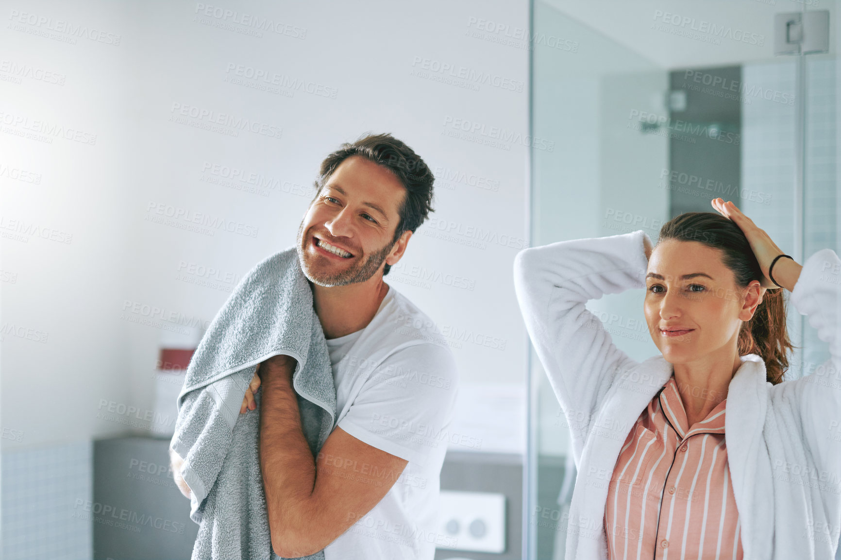 Buy stock photo Couple, getting ready and happy in bathroom for morning routine with skincare, grooming and haircare in home. People, smile or cosmetics with hygiene preparation, start of day or wellness for wake up