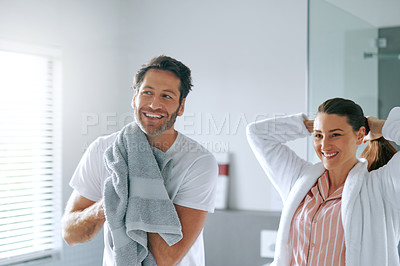 Buy stock photo Cropped shot of a couple getting ready together in the bathroom at home