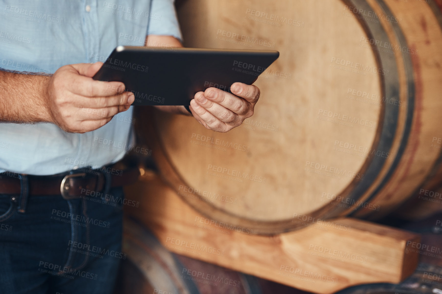 Buy stock photo Hands, person and working with tablet in brewery, inventory check or manufacturing for beer production with tech. Factory, manager or inspection with digital for search, barrel or business management