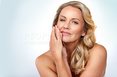 Buy stock photo Studio portrait of an attractive mature woman posing against a grey background