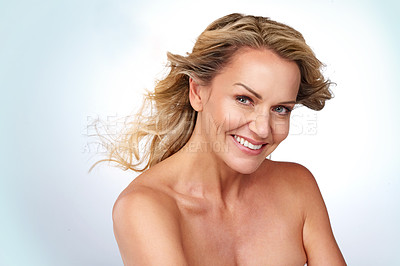 Buy stock photo Studio portrait of an attractive mature woman posing against a grey background