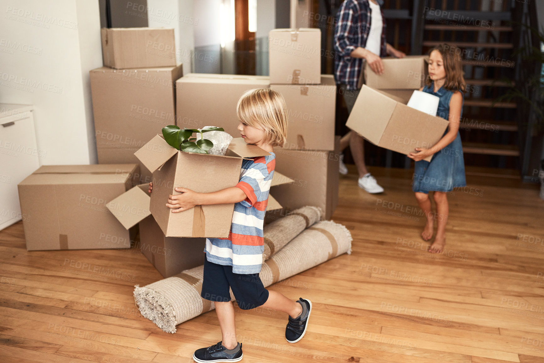 Buy stock photo Shot of a young family on their moving day