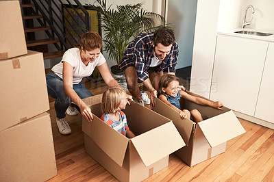 Buy stock photo Shot of a young family on their moving day