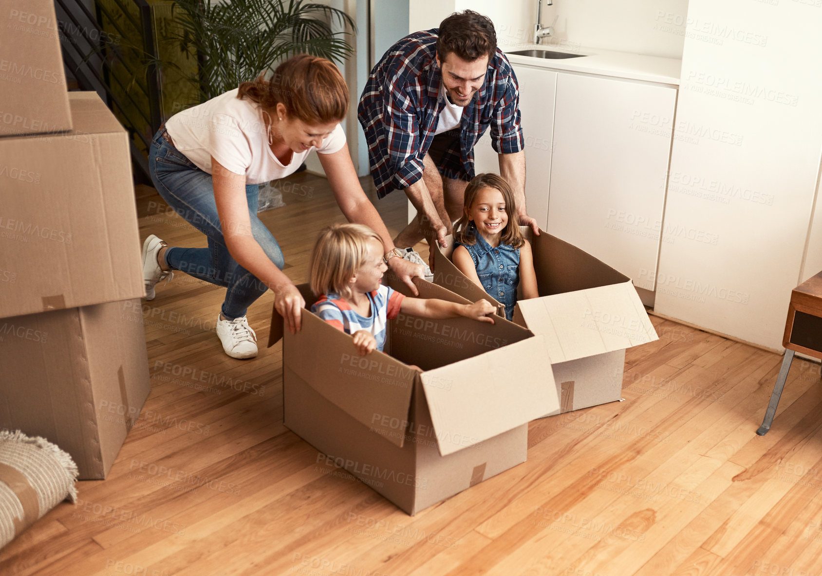 Buy stock photo Shot of a young family on their moving day