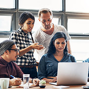 Reviewing their latest designs | Buy Stock Photo on PeopleImages ...