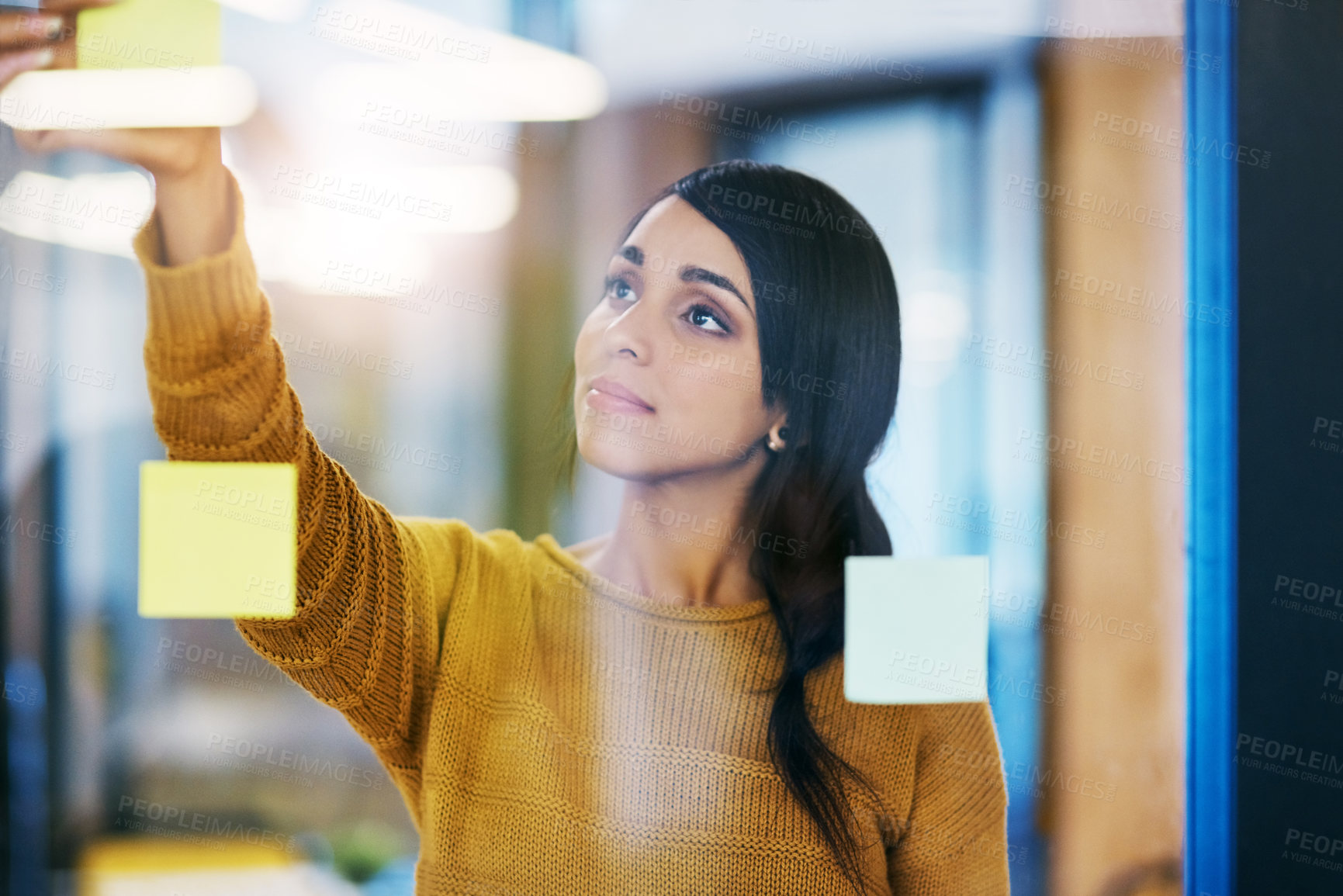 Buy stock photo Woman, sticky note and glass wall in office for ideas, planning or brainstorming at company. Person, thinking and paper on board for problem solving, solution or process for job at creative agency