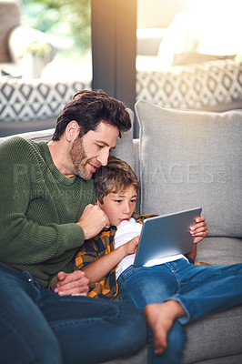 Buy stock photo Father, boy kid and tablet on sofa in home for educational games, watching cartoon and bonding. Love, man and son with digital app on couch in lounge for online video and streaming service in house