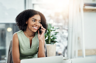 Buy stock photo Cropped shot of an attractive young businesswoman making a phonecall while working at her desk in the office