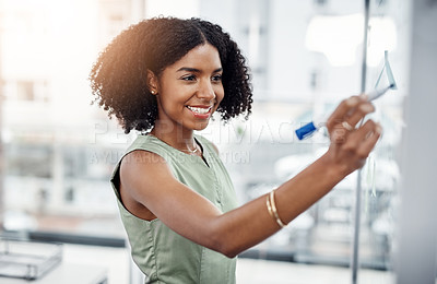 Buy stock photo Glass wall, business and black woman writing, planning or strategy in office. Brainstorming, board and happy female person write, working on project and schedule, notes or information in workplace.