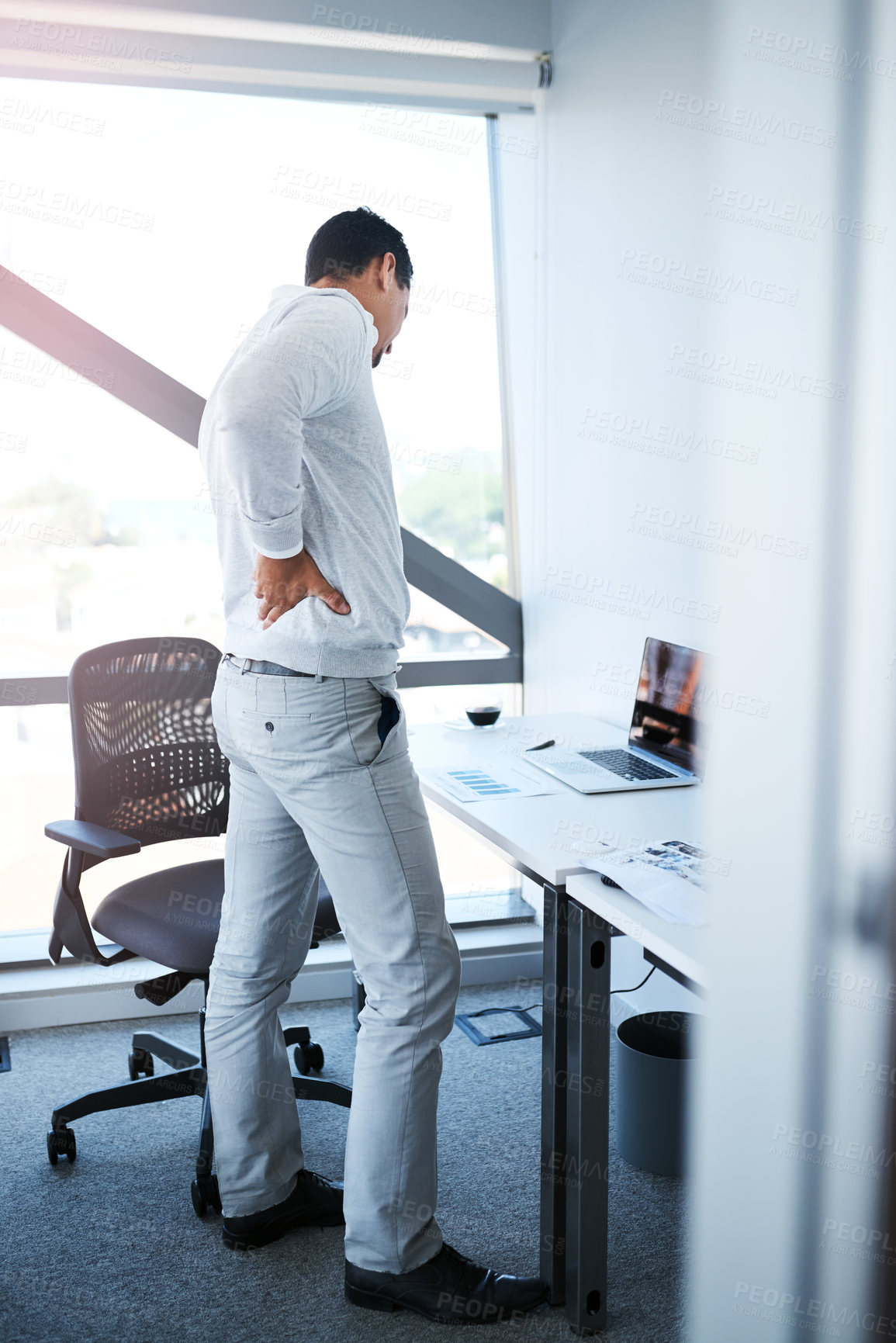 Buy stock photo Businessman, back pain and injury with stress, pressure or burnout from mistake or anxiety in office. Tired man, employee and inflammation with sore ache, strain or overworked with workplace accident