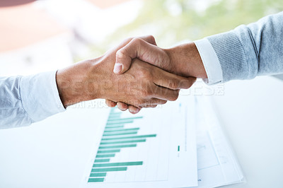 Buy stock photo Handshake, teamwork and business people in office with paperwork for B2B deal, agreement or meeting. Above, graphs and employees shaking hands for partnership, collaboration or project data analytics