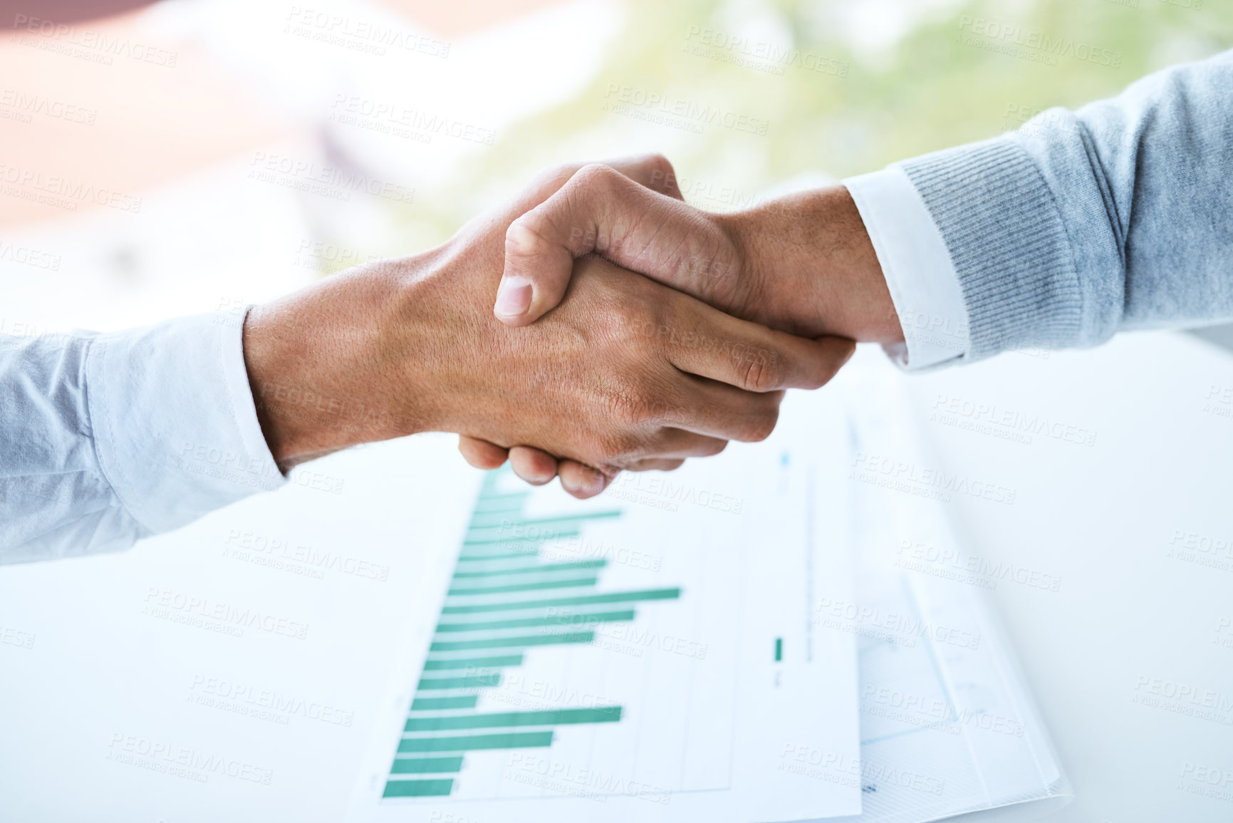 Buy stock photo Handshake, teamwork and business people in office with paperwork for B2B deal, agreement or meeting. Above, graphs and employees shaking hands for partnership, collaboration or project data analytics