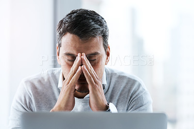 Buy stock photo Frustrated businessman, laptop and debt with stress for bankruptcy or financial crisis at office. Tired man, employee or trader with headache, pressure or strain for mistake, bad investment or loss