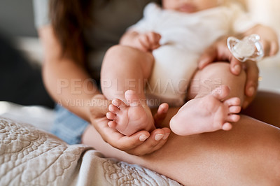 Buy stock photo Feet, bed and hands of parent with baby in home for loving relationship, playing and bonding in morning. Family, parenting and closeup of newborn toes in bedroom for development, cute and wellness