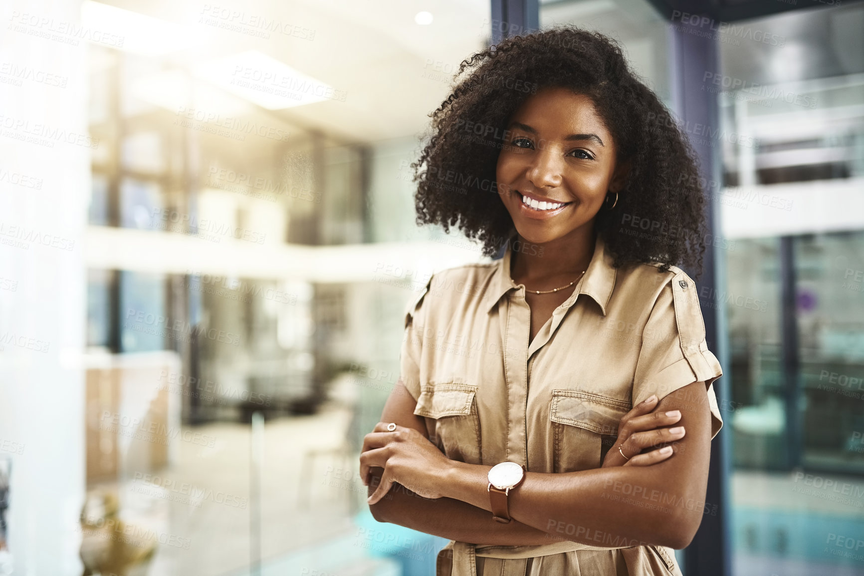 Buy stock photo Happy, portrait or business woman with confidence at office for career, job or creative employment. Young African, female person or employee with smile or arms crossed for startup at modern workplace