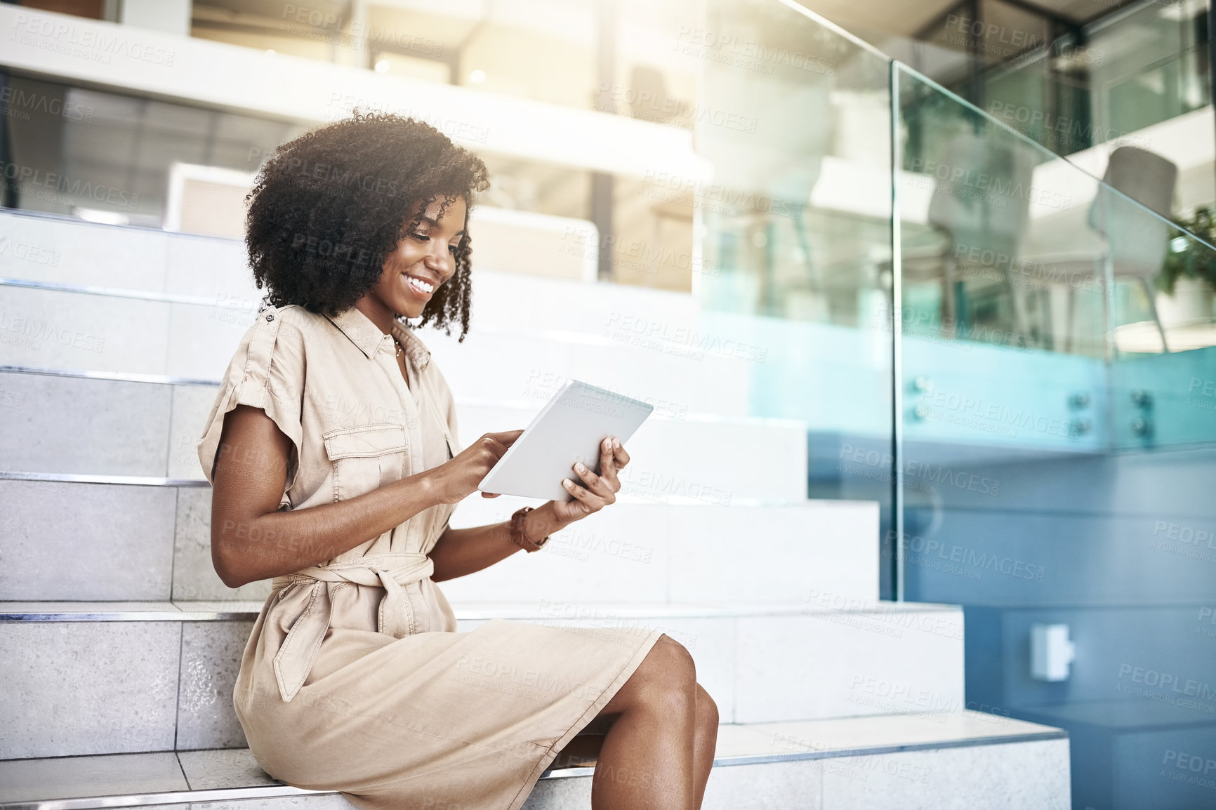 Buy stock photo Business, smile and tablet with black woman on steps in office for internet research. App, company and technology with happy corporate employee reading online information in professional workplace