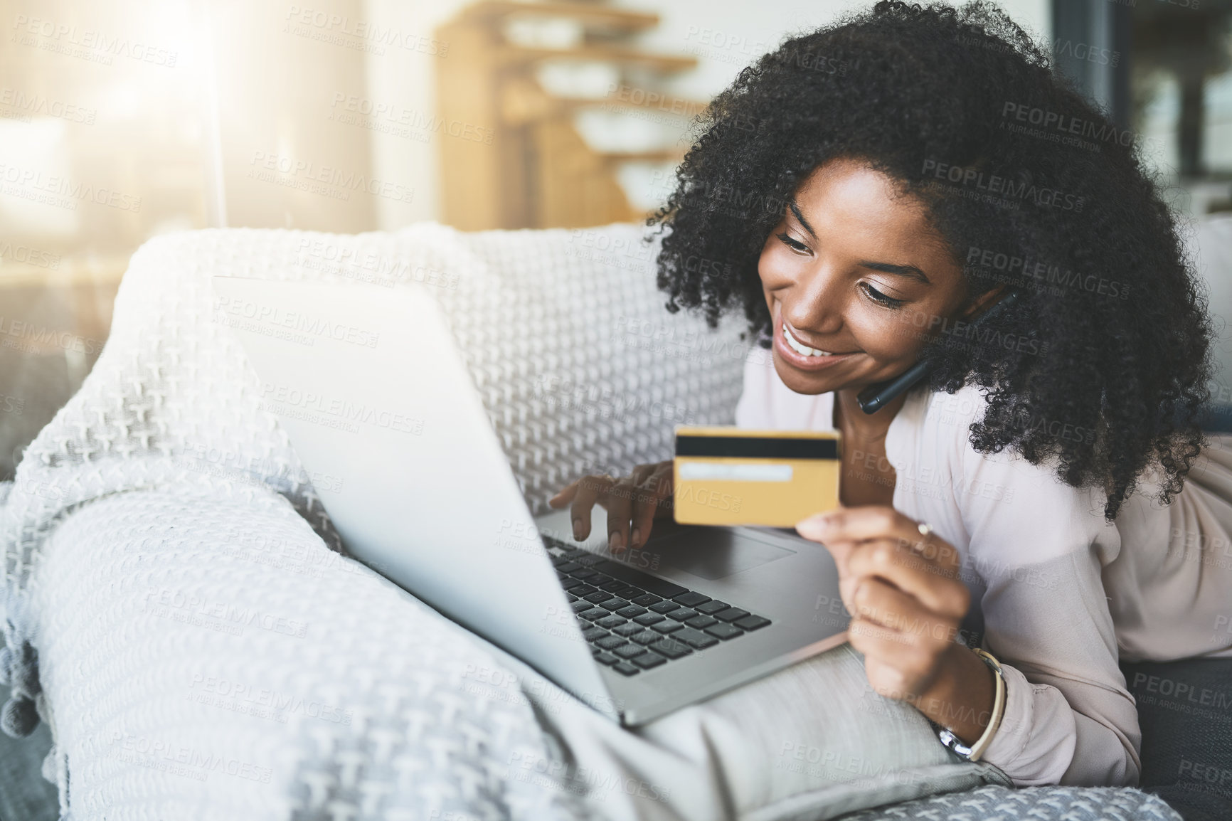 Buy stock photo Shot of an attractive young woman relaxing at home