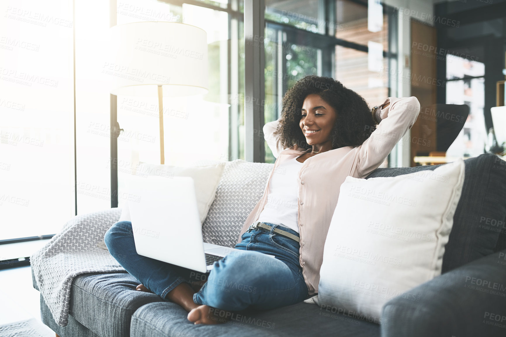 Buy stock photo Happy, relax and black woman on laptop on sofa for website, internet and remote work. Freelancer, professional and person on computer for research, connection and working from home in living room